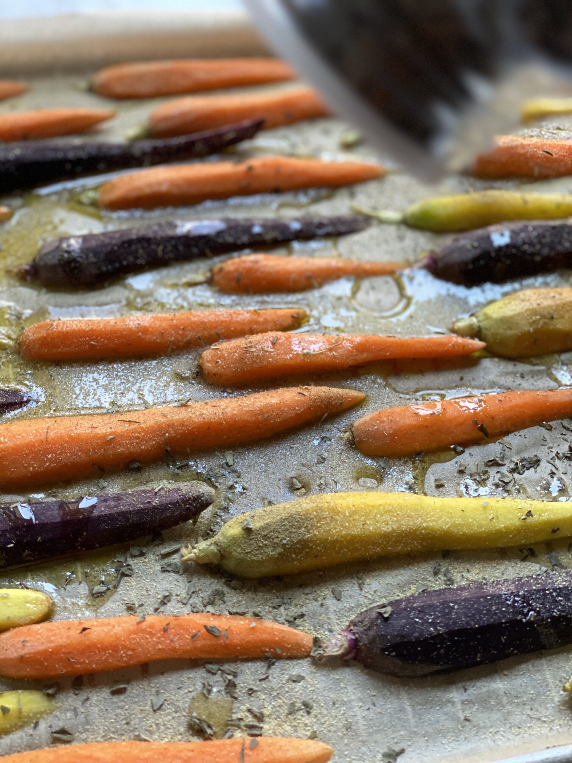 Adding balsamic glaze to garlic roasted carrots