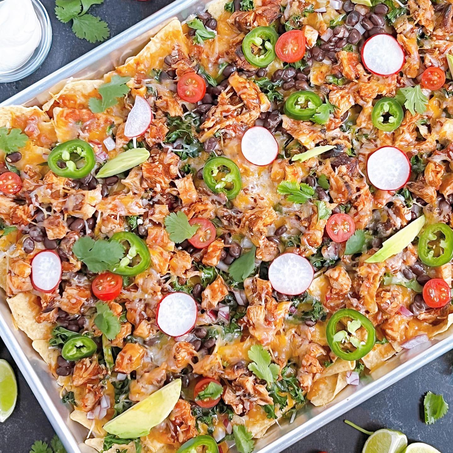 I hope y’all didn’t forget the nachos this year for the Super Bowl game tonight! 🏈 I promise my Loaded Sheet Pan Chicken Nachos are super easy! Think I’m kidding? Check out my video reel. 

RECIPE LINKED TO PROFILE BIO 👉🏽

°°°
#loadednachos #superbowlfood #chickennachos #footballparty #superbowlhalftimeshow #dcfoodie #dmvfoodies #dmvfoodporn #dcfood #chickenrecipe #nachorecipe #gamedayfood #dcfoodblogger #dmvfoodblogger #sheetpanrecipes #grilledchickennachos #blackgirlswhocook #homecooking #homerecipes #easynachos